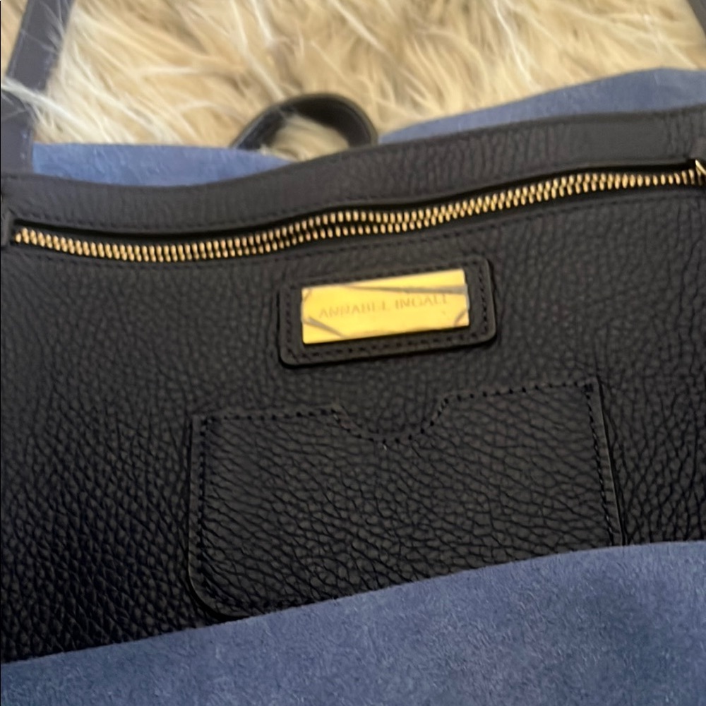 Annabel Ingall “Isabella” Large Navy blue Shoulder Bag monogrammed CP on it.